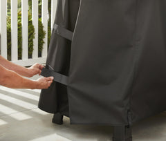 Weber Searwood 600 XL fastening strap detail showing secure fit and wind protection