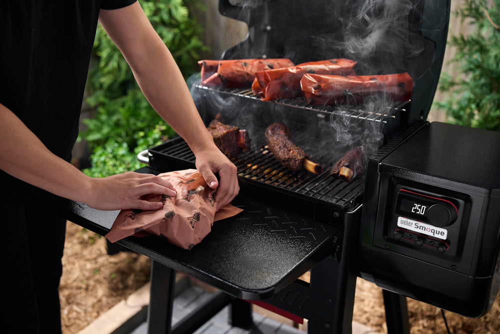 Weber Searwood table beside cutting board illustrating generous workspace advantage