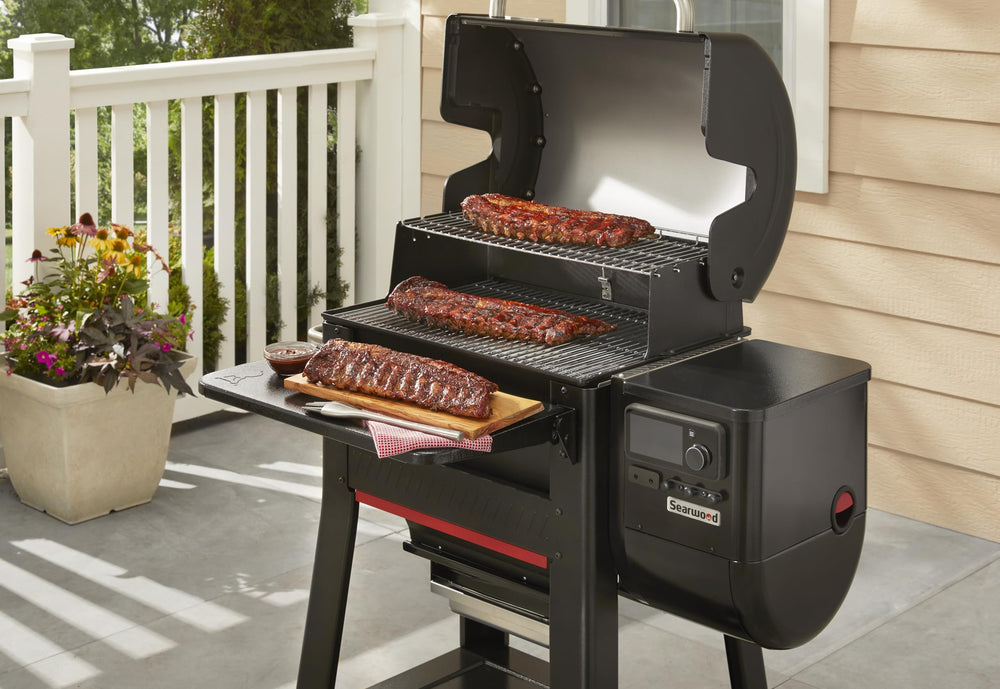 Weber Searwood table in use holding plates and tools for organized grilling