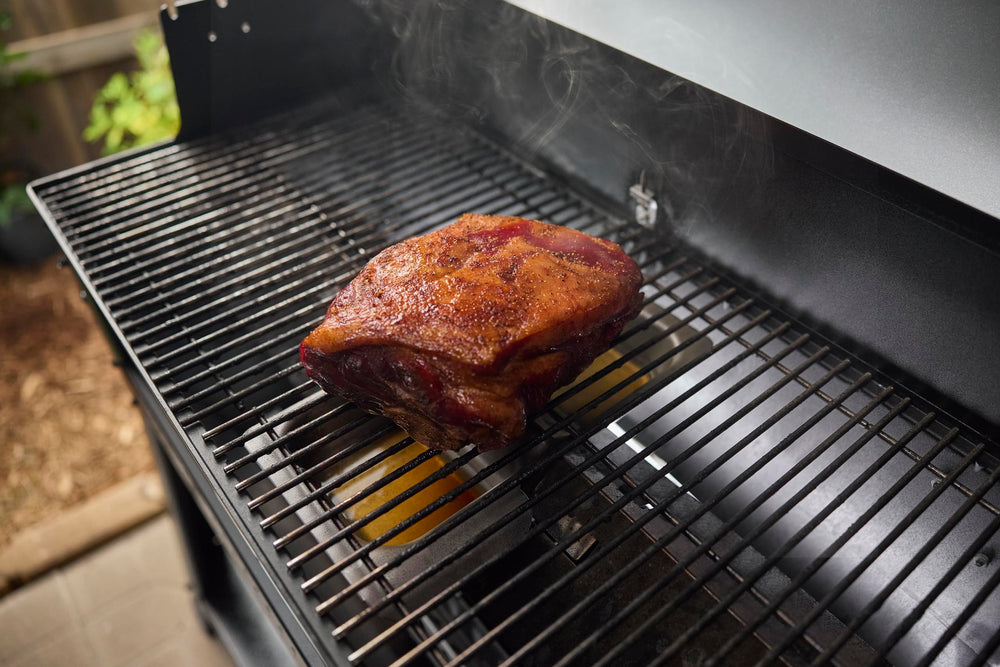 Weber Searwood wet smoke pan installed on Flavorizer bar producing steam to keep meat juicy