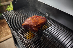 Weber Searwood wet smoke pan installed on Flavorizer bar producing steam to keep meat juicy