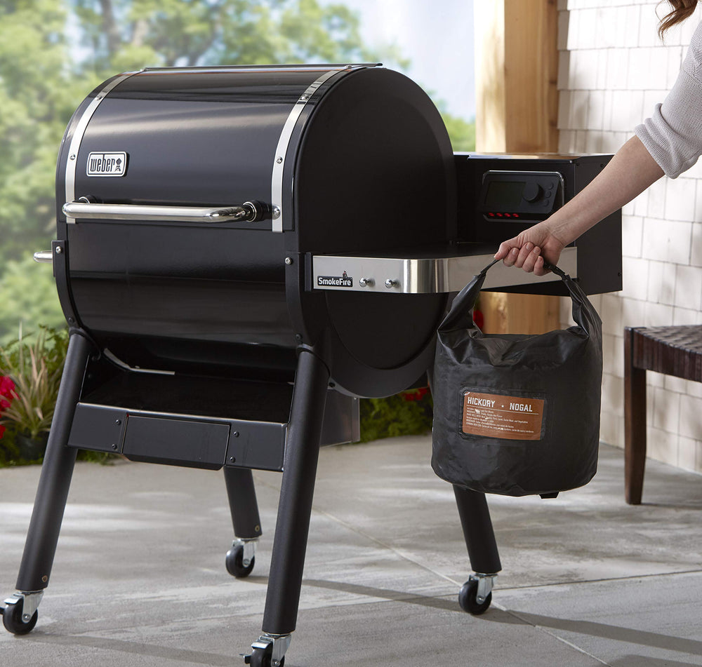 Weber bag next to a 20 lb fuel bag demonstrating true capacity benefit