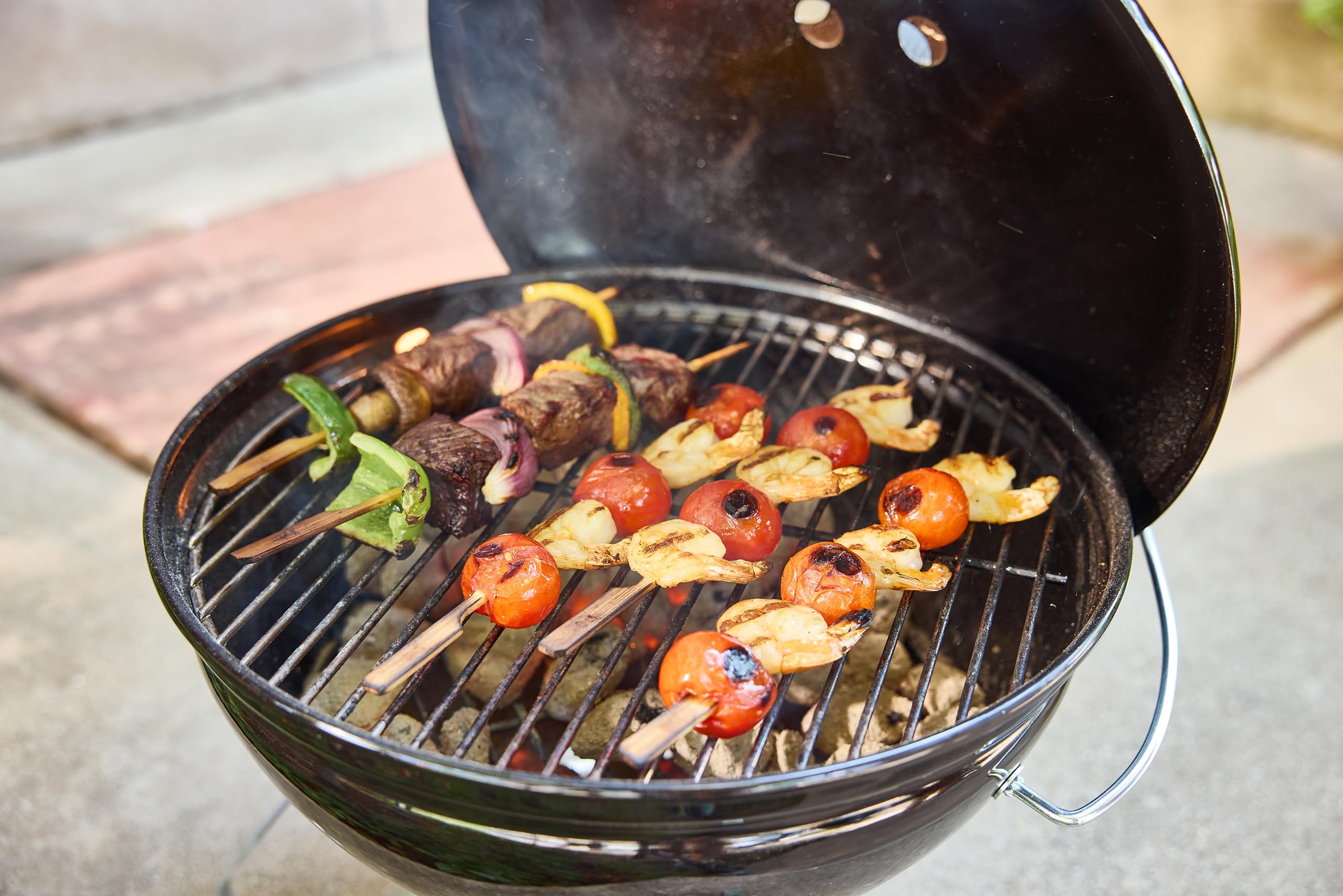 Weber Smokey Joe chrome cooking grate closeup showing cooking capacity benefit