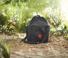 Weber bag being carried outdoors showing padded strap comfort benefit
