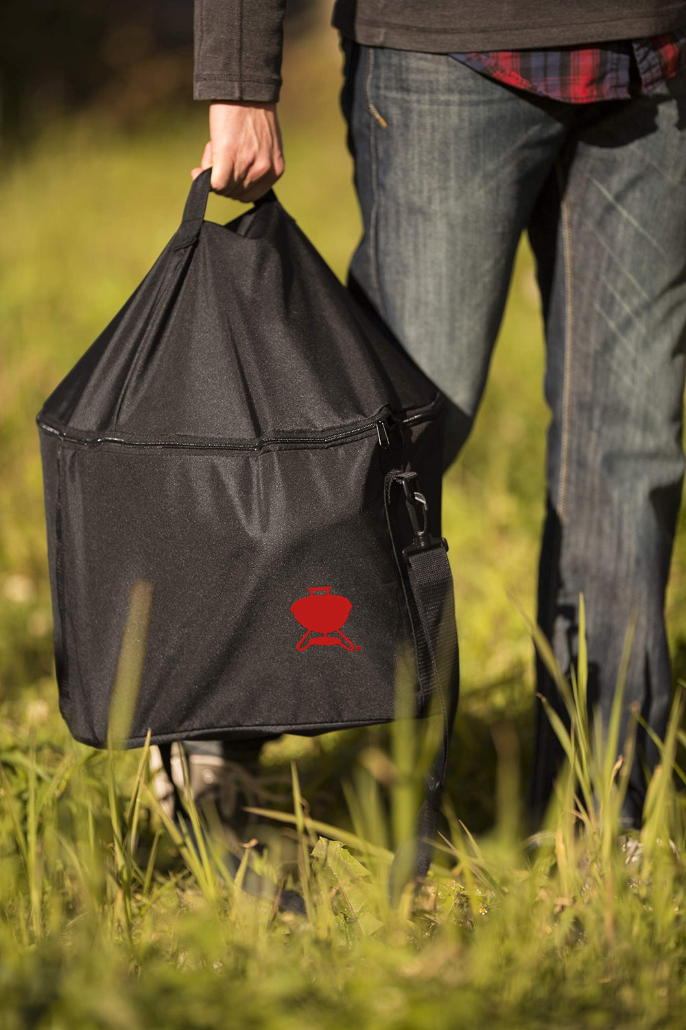 Weber bag next to grill showing correct 14-inch fit and storage benefit