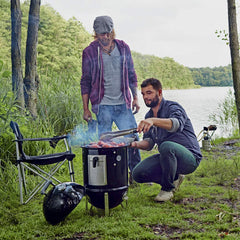 Weber Smokey Mountain with lid open showing easy access and grilling benefit