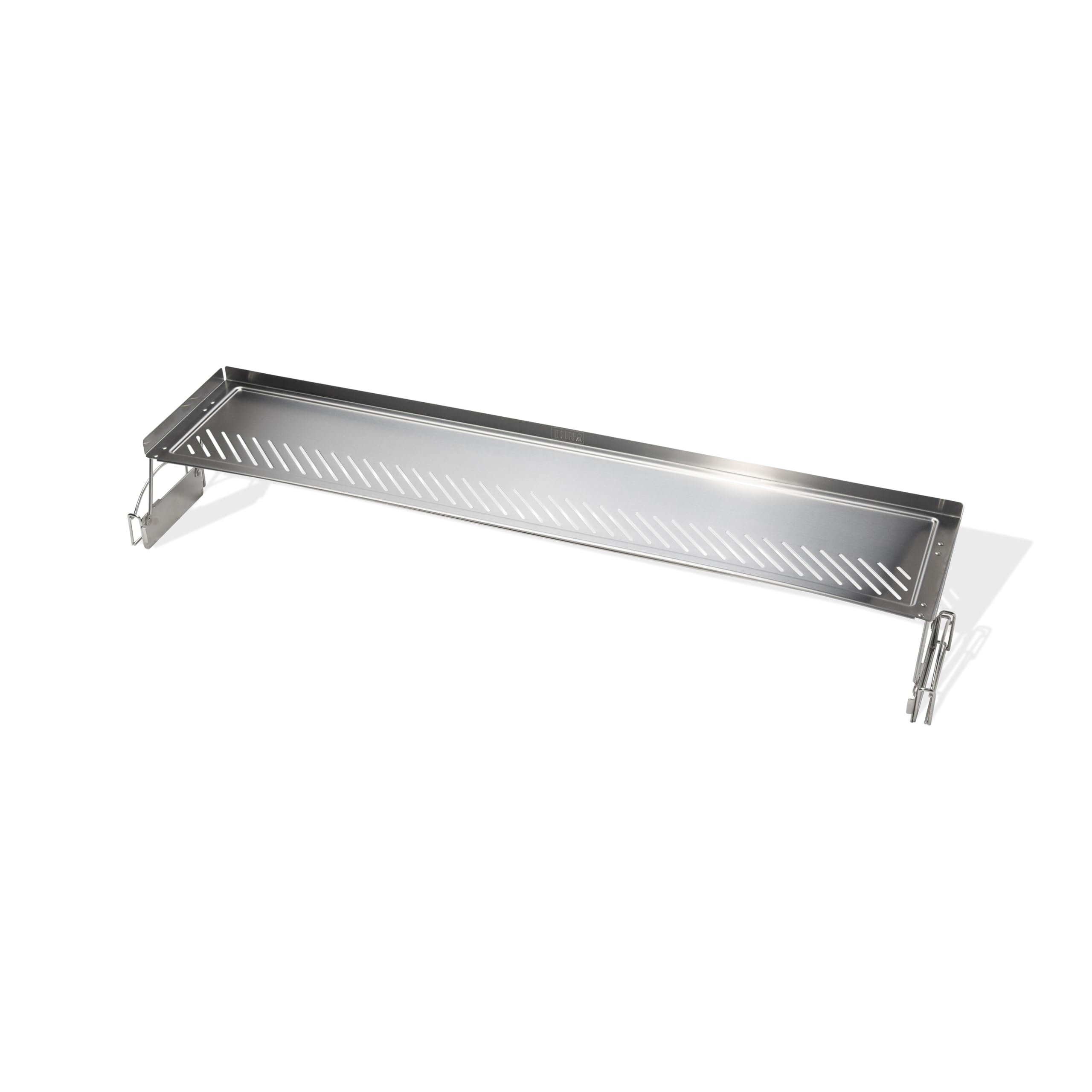 Weber warming rack close up showing narrow slits and raised edges for secure holding