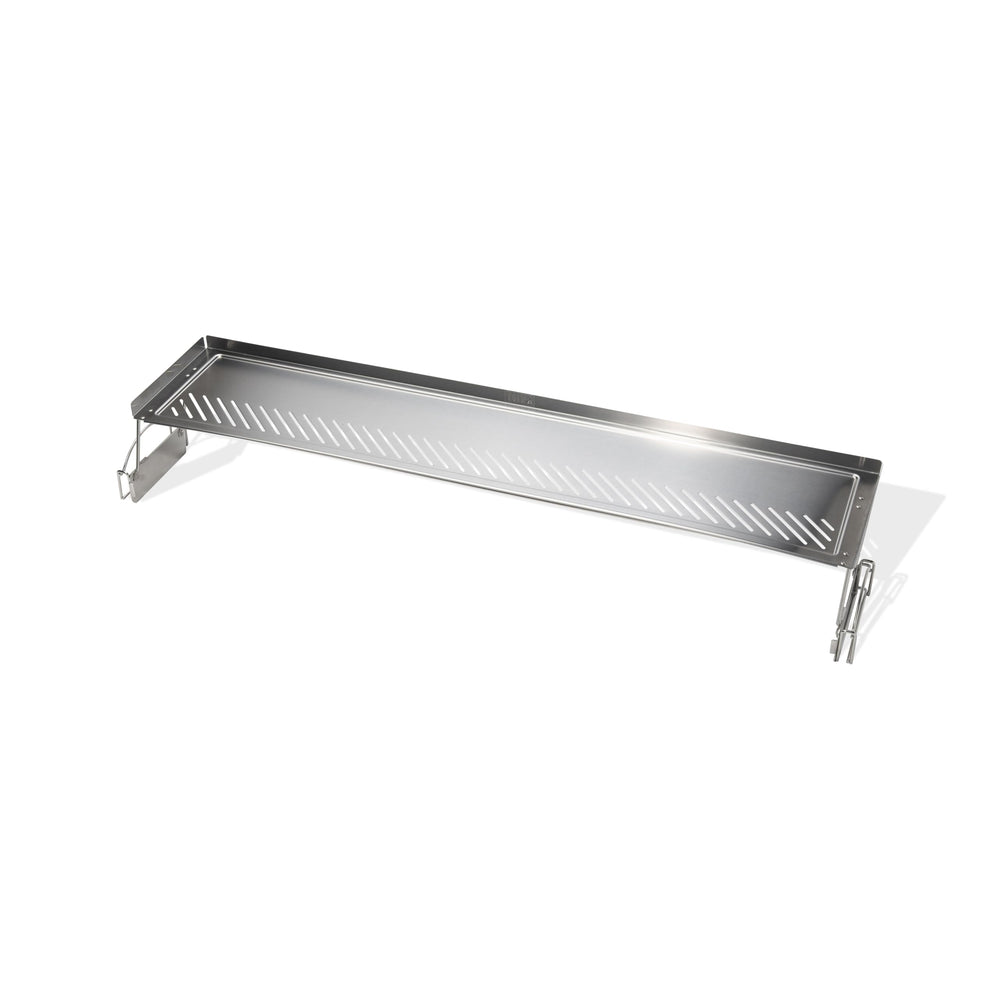 Weber warming rack close up showing narrow slits and raised edges for secure holding