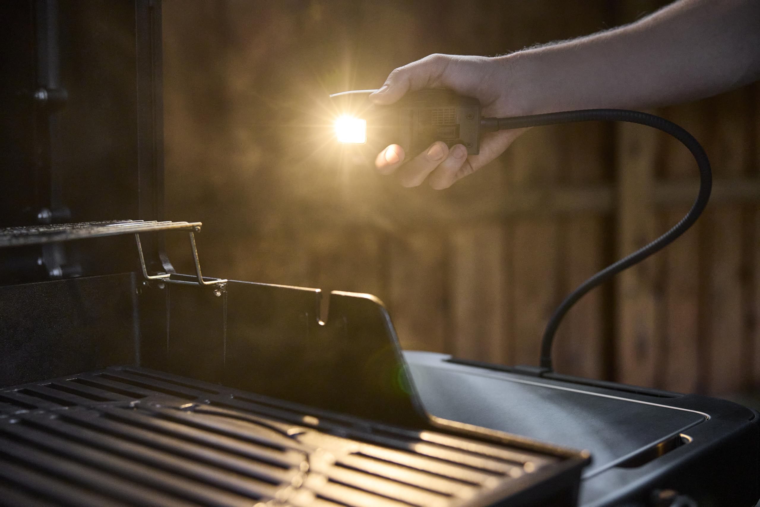 Weber Flex Light bent at angle demonstrating adjustable beam control