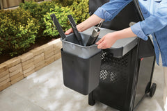 Weber tool holder attached with tongs and spatula for organized grilling