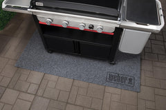 Weber mat in use under grill station demonstrating heat protection and tidy workspace