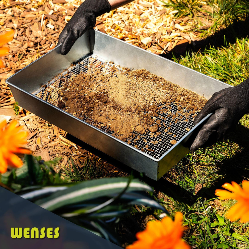 Wenses sifter next to wheelbarrow to show larger capacity