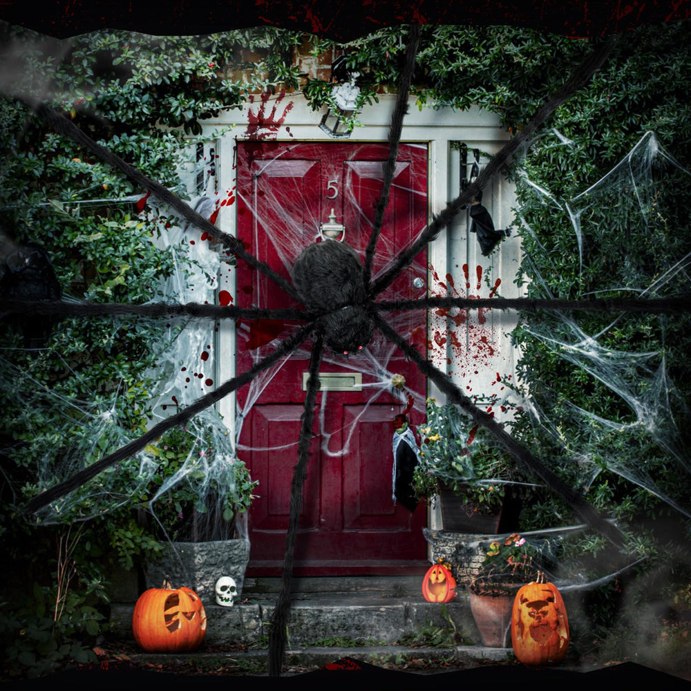 Wettarn spider installed on porch railing giving visitors a startling welcome