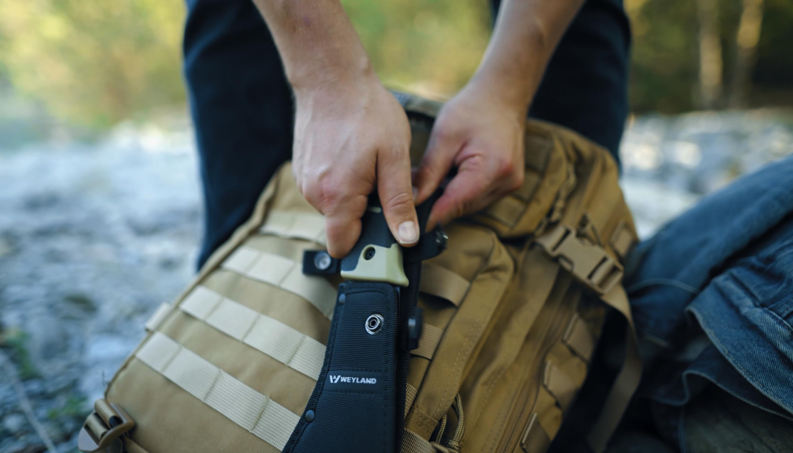 WEYLAND MOLLE sheath attached to backpack showing versatile carry benefit