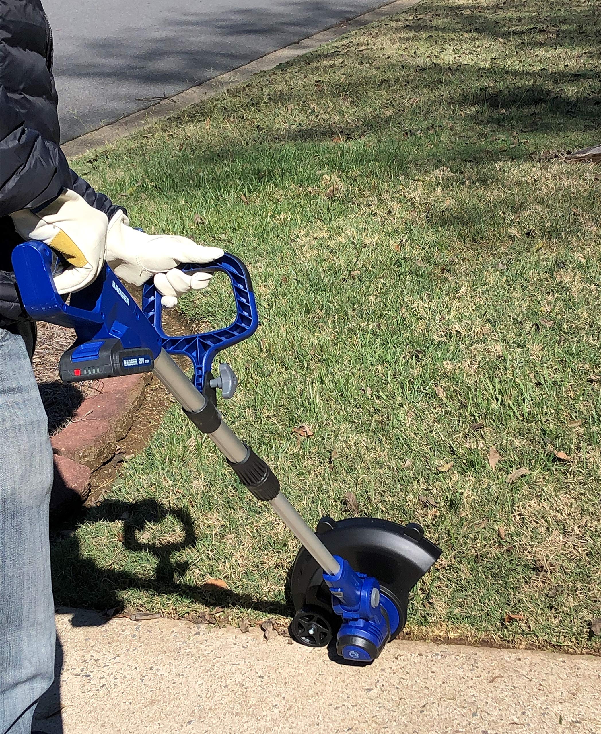 Wild Badger Power kit in a backyard lifestyle scene illustrating quiet cordless yard care