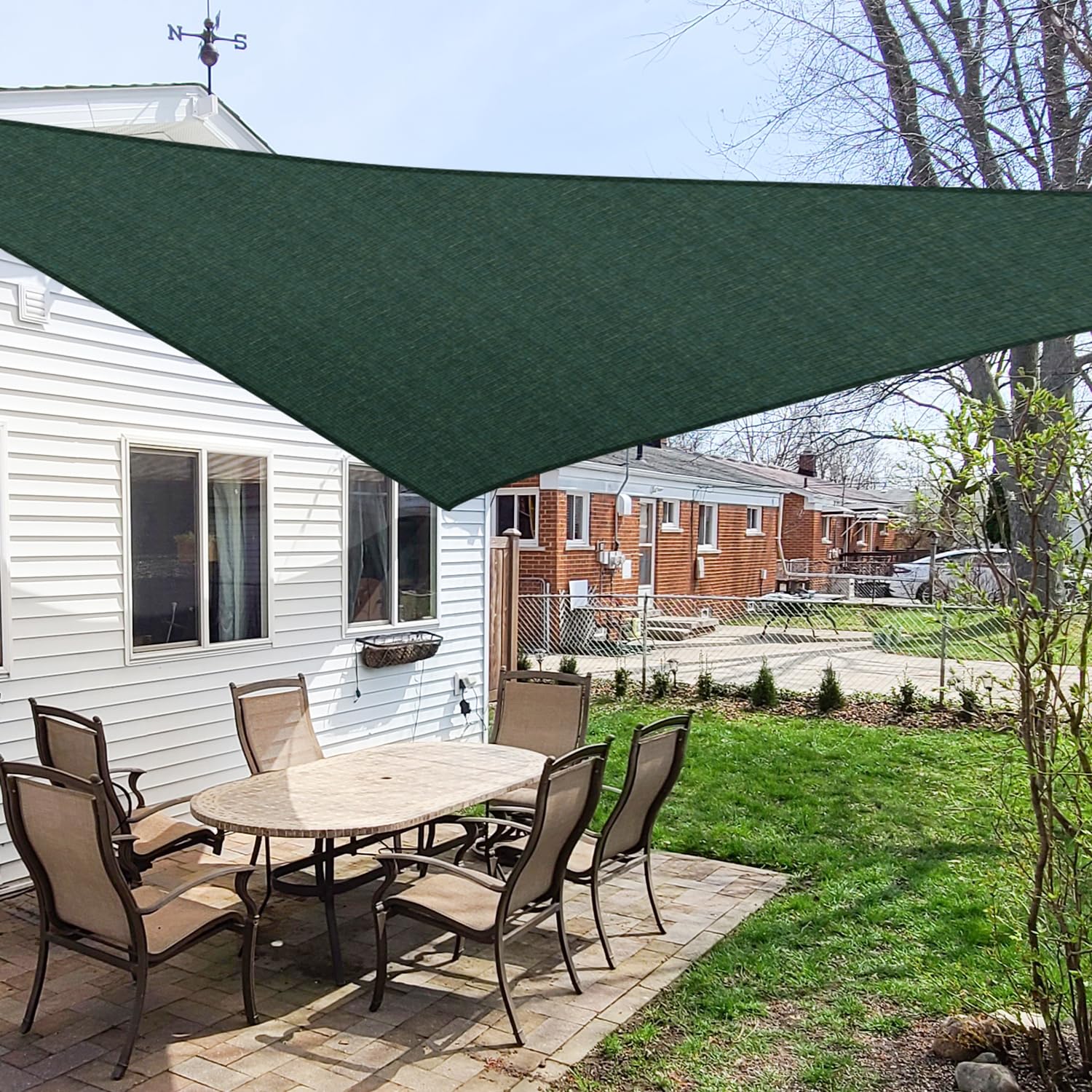 Windscreen4less front view of green triangle shade providing instant patio cover