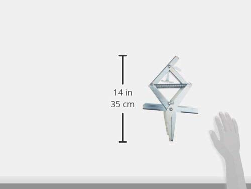 Wire Tek trap beside a hand for scale showing compact reusable design advantage