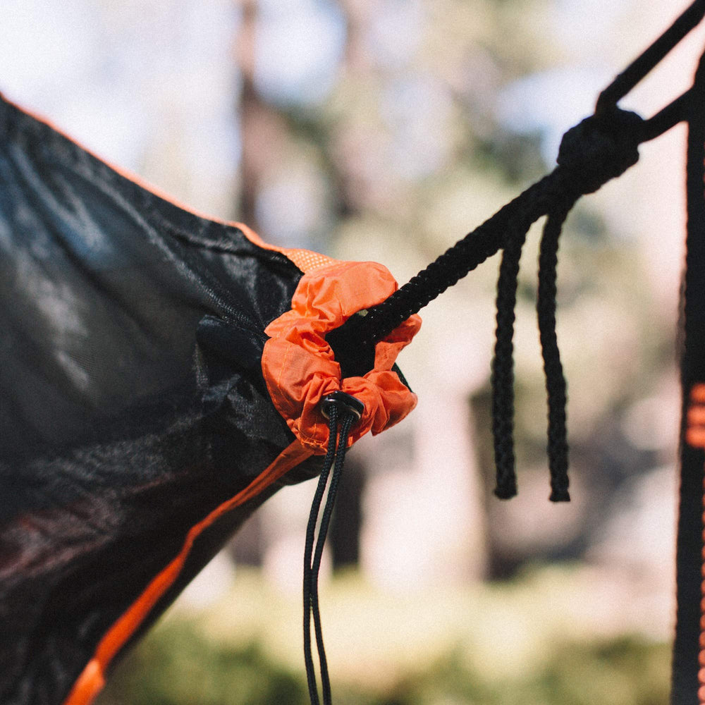 Wise Owl Outfitters SnugNet installed on hammock in forest offering insect-free rest