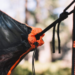 Wise Owl Outfitters SnugNet installed on hammock in forest offering insect-free rest
