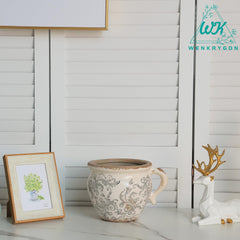 WK WENKRYGDN crackle glaze and floral detail highlighting artisanal aesthetic benefit