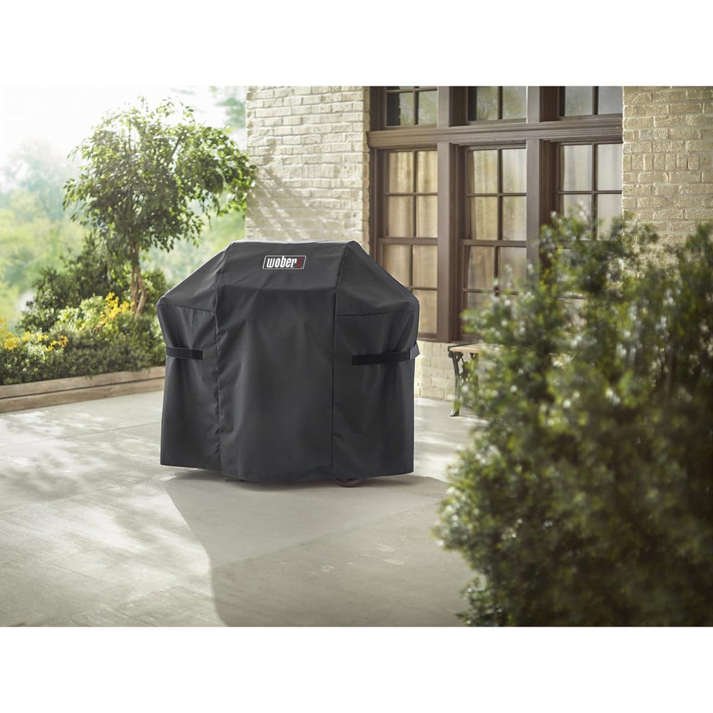WOBER COVER on an outdoor grill in a patio scene protecting from rain and dust