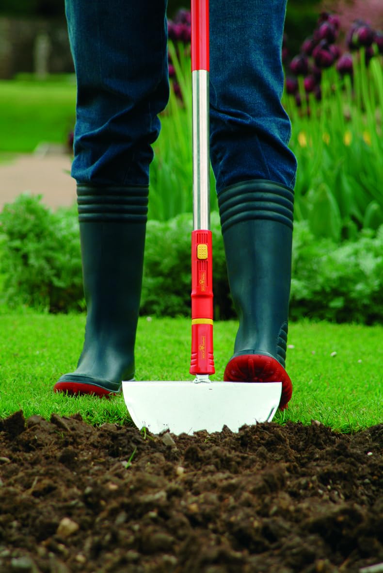 WOLF-Garten handle attached to a rake head, demonstrating versatility