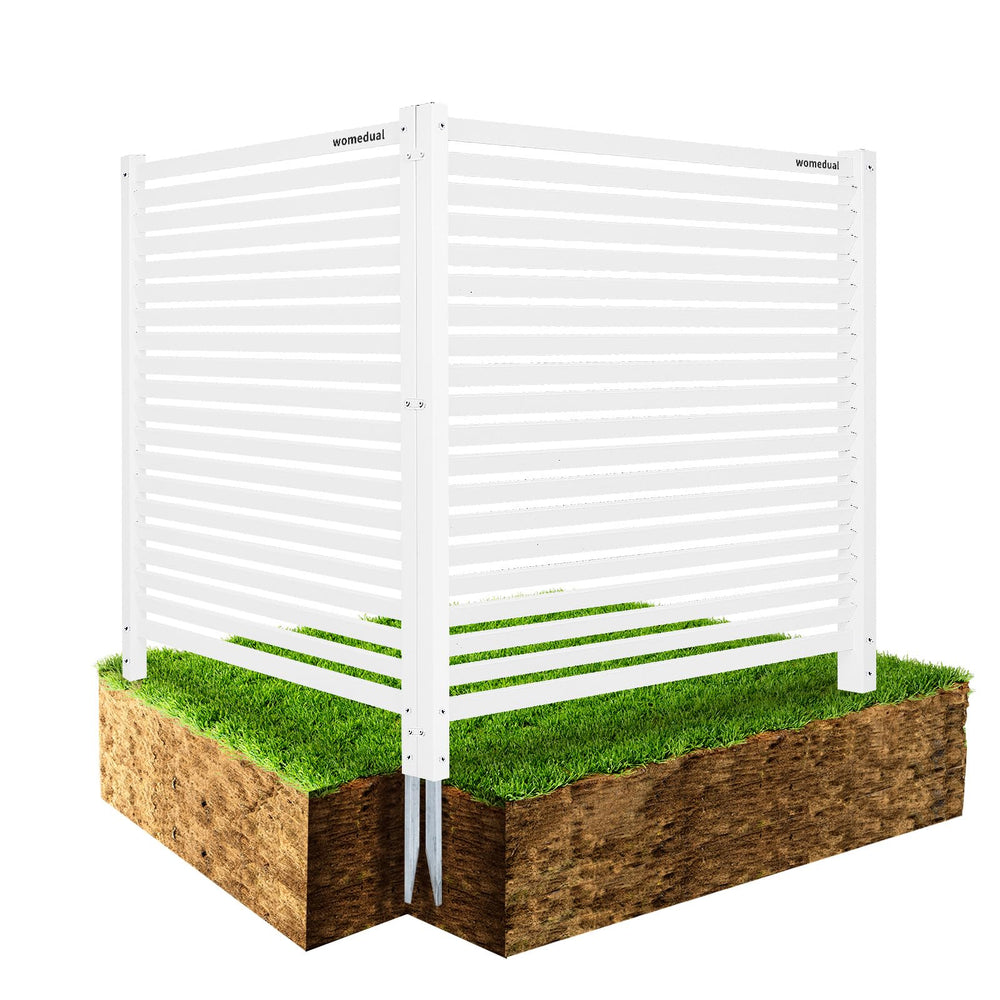 WOMEDUAL front view installed white vinyl fence conceals equipment and improves curb appeal