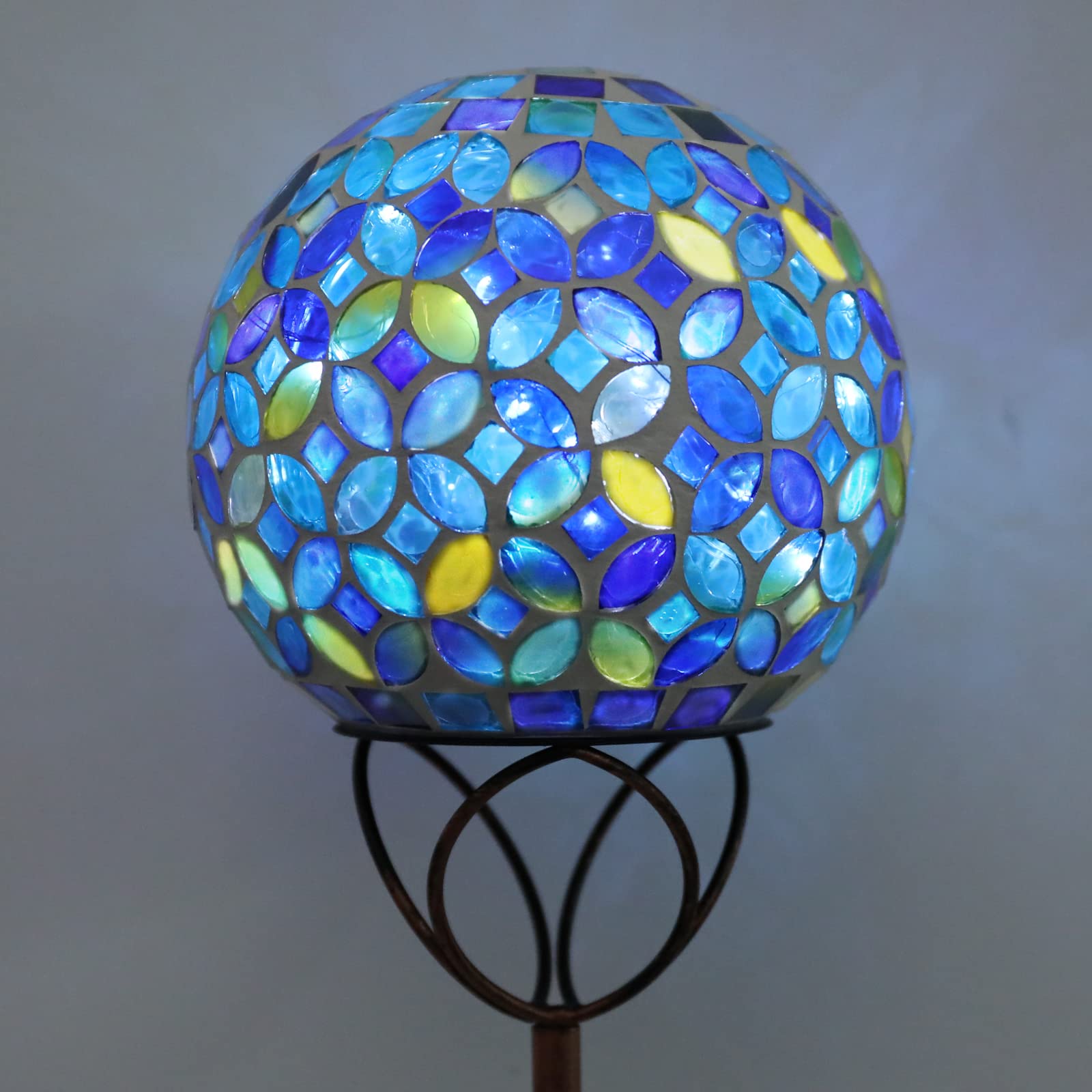 Wonder Solar globe installed among flowers adding color and low maintenance lighting