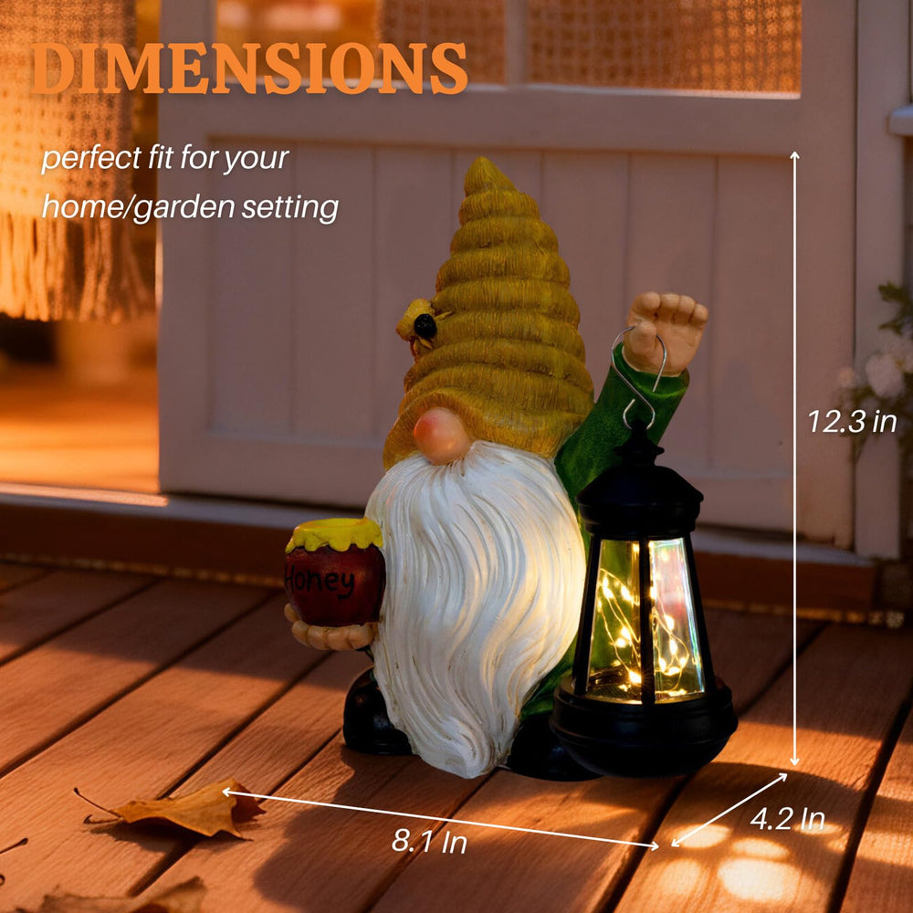 WONDHOME bee gnome placed in garden bed adding charm and soft pathway light