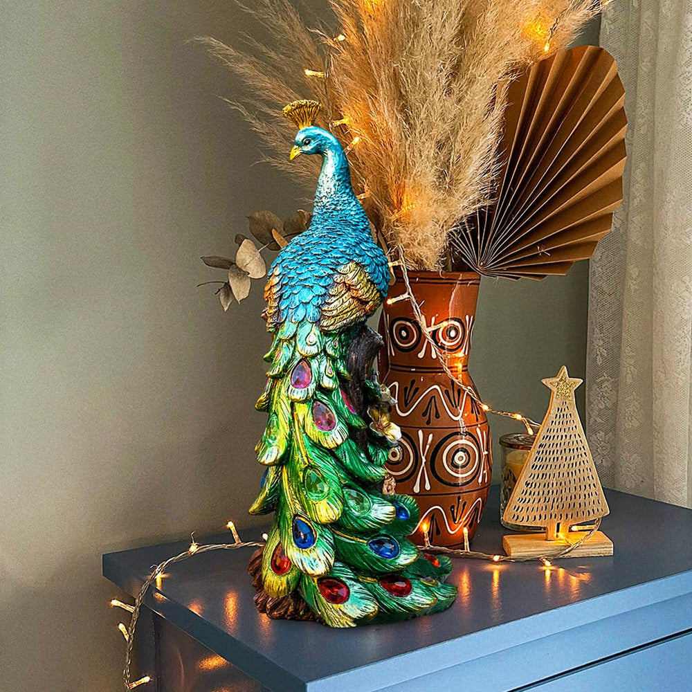 WONDHOME peacock lit at night with LED tail creating colorful evening ambiance