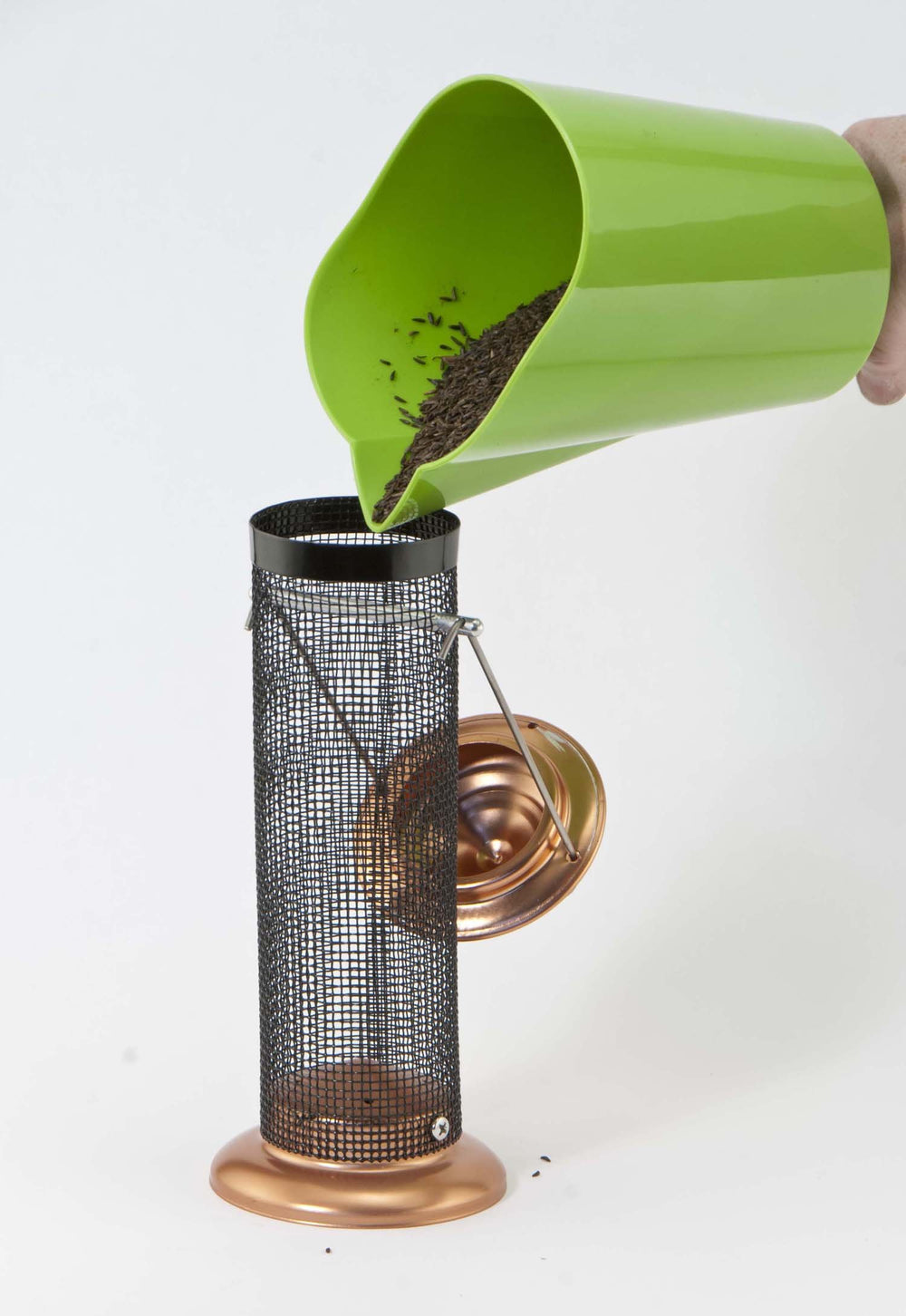 Woodlink Coppertop bottom tray showing drainage holes that keep seed dry and reduce waste