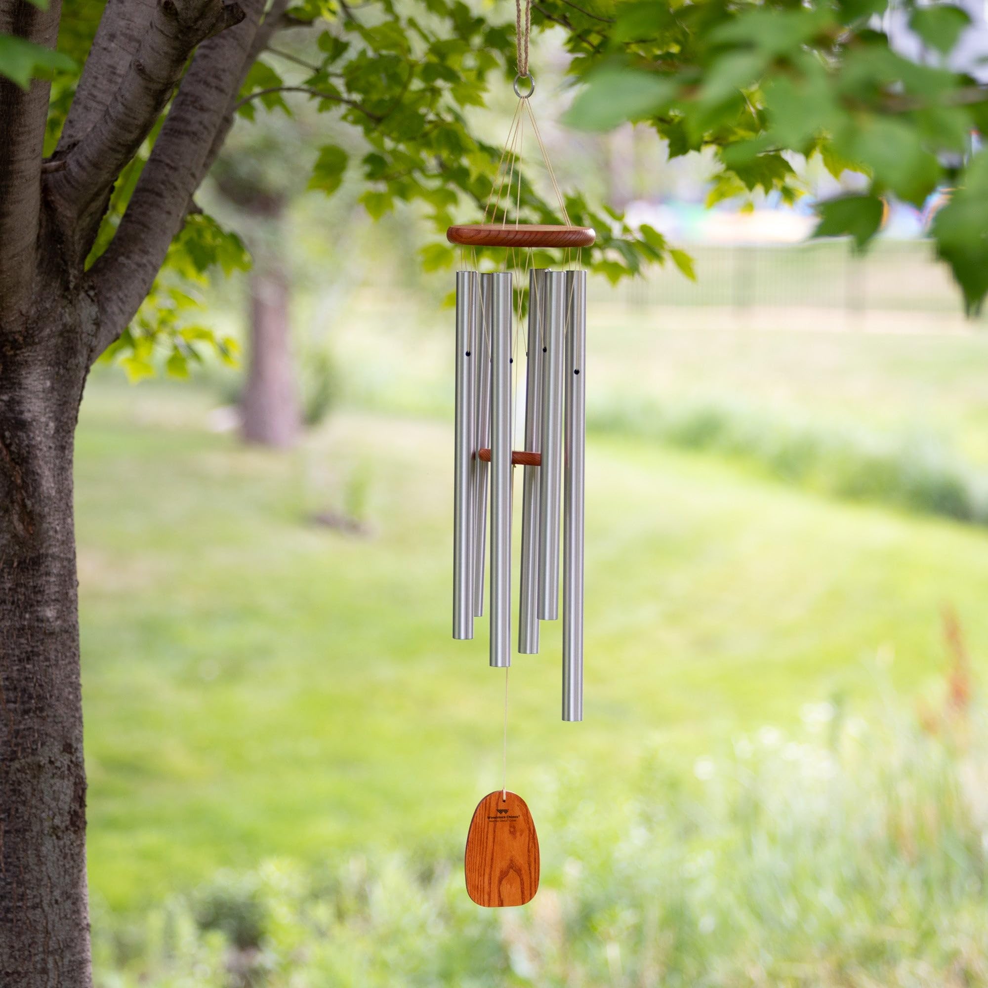 Woodstock Chimes materials overview showing wood and tubes benefit: crafted for durable outdoor use