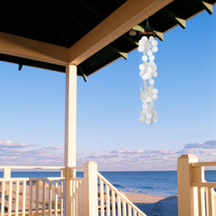 Woodstock Chimes close-up of capiz shell texture, highlights handcrafted luminous finish