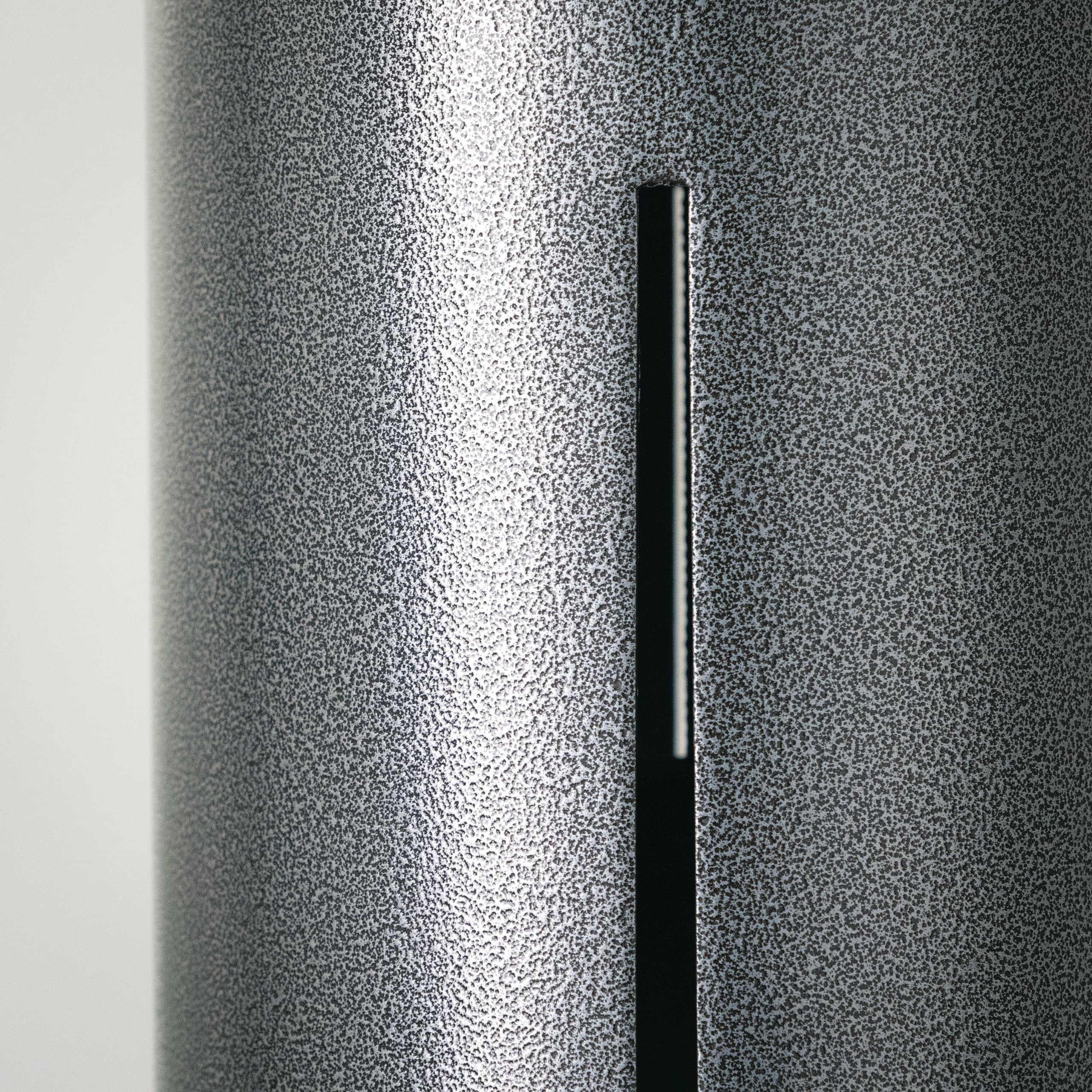 Woodstock Chimes beside a chair showing 40-inch scale and substantial decorative size