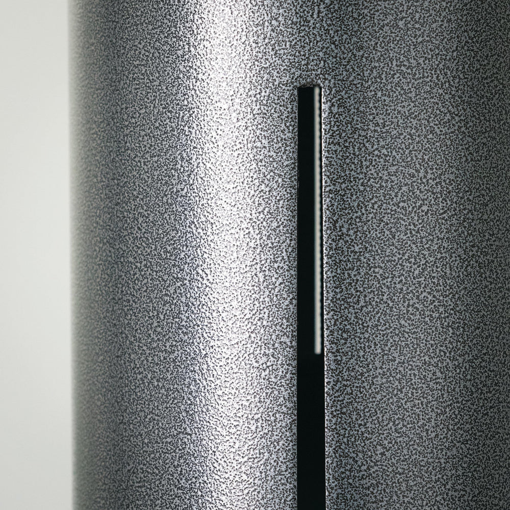 Woodstock Chimes beside a chair showing 40-inch scale and substantial decorative size