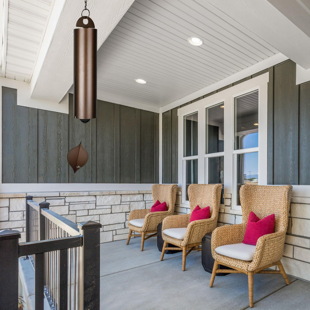 Woodstock Chimes size comparison beside chair showing scale and outdoor fit