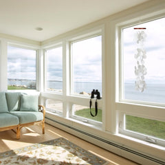 Woodstock Chimes hanging on a porch, demonstrates gentle motion and outdoor ambiance