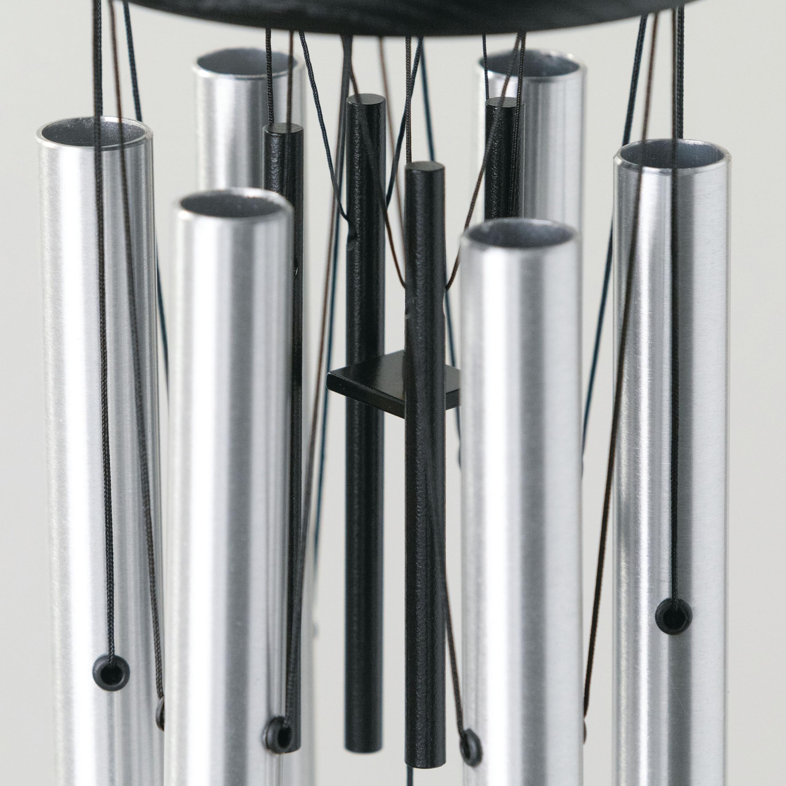 Woodstock Chimes ash wood top detail with black finish, provides weather-resistant durability
