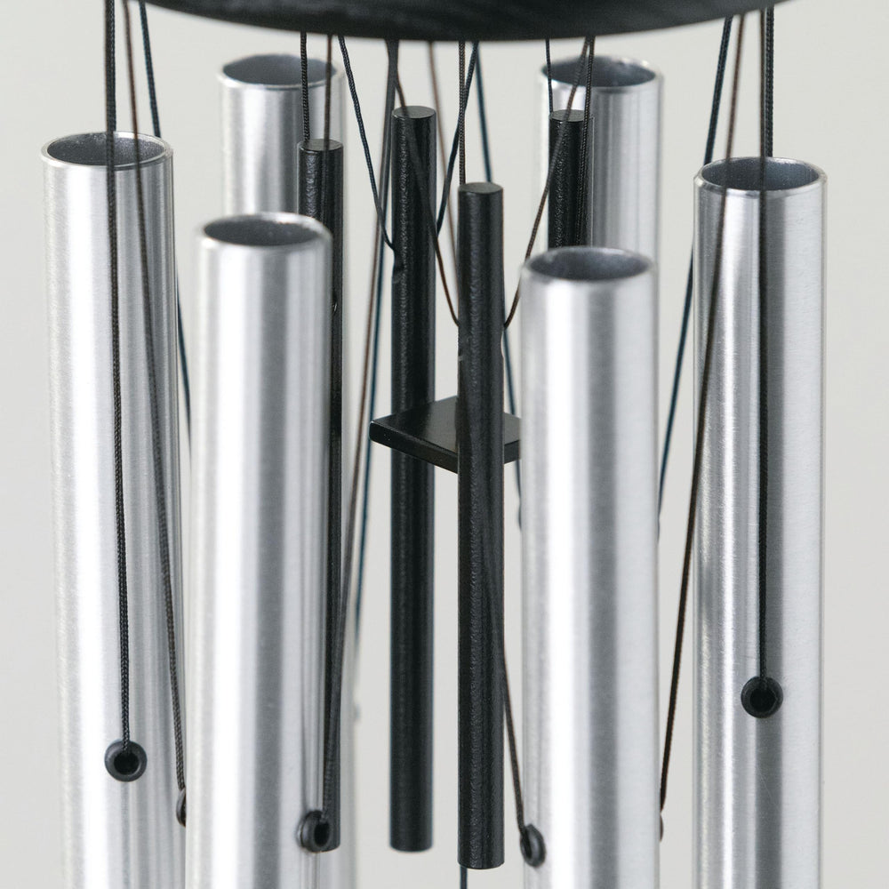 Woodstock Chimes ash wood top detail with black finish, provides weather-resistant durability