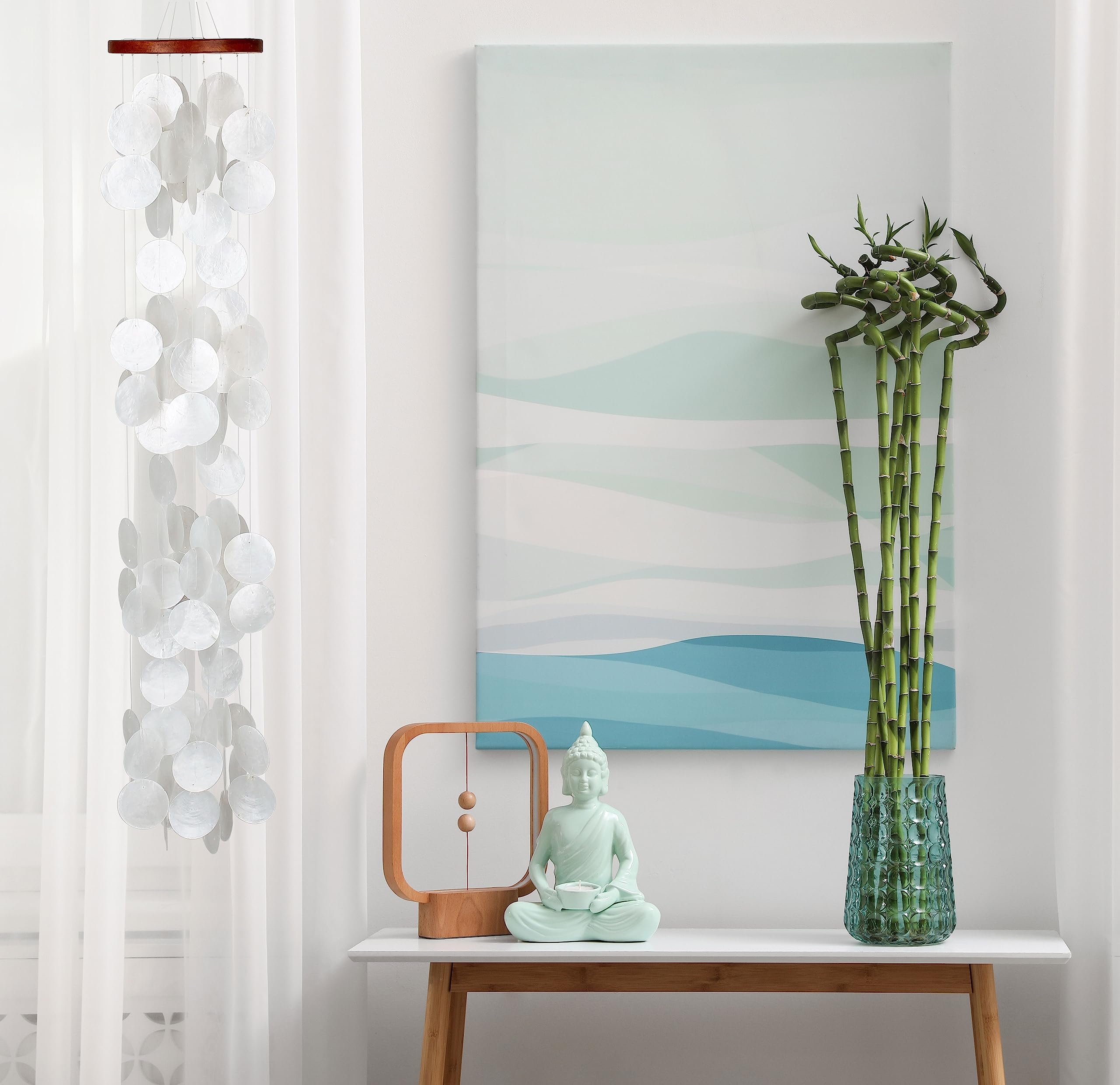 Woodstock Chimes size shown in hands, conveys 40 inch scale and easy placement