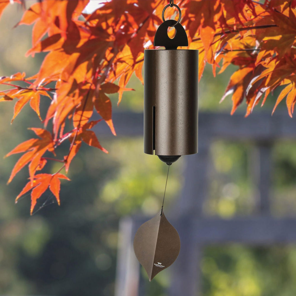 Woodstock Chimes close-up of bell slots and aged copper surface highlighting resonant design for deeper tone