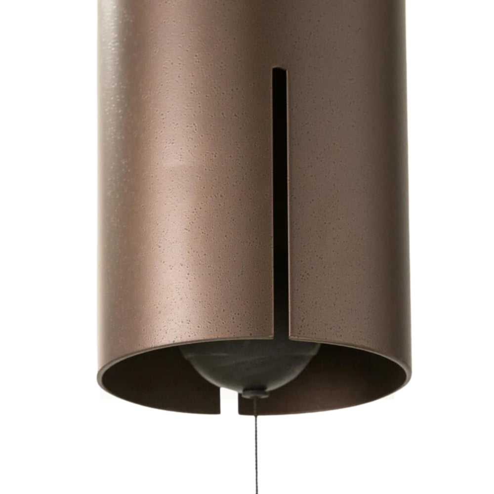 Woodstock Chimes windbell held next to a hand to show 40-inch length and 6-inch bell scale for deep tones