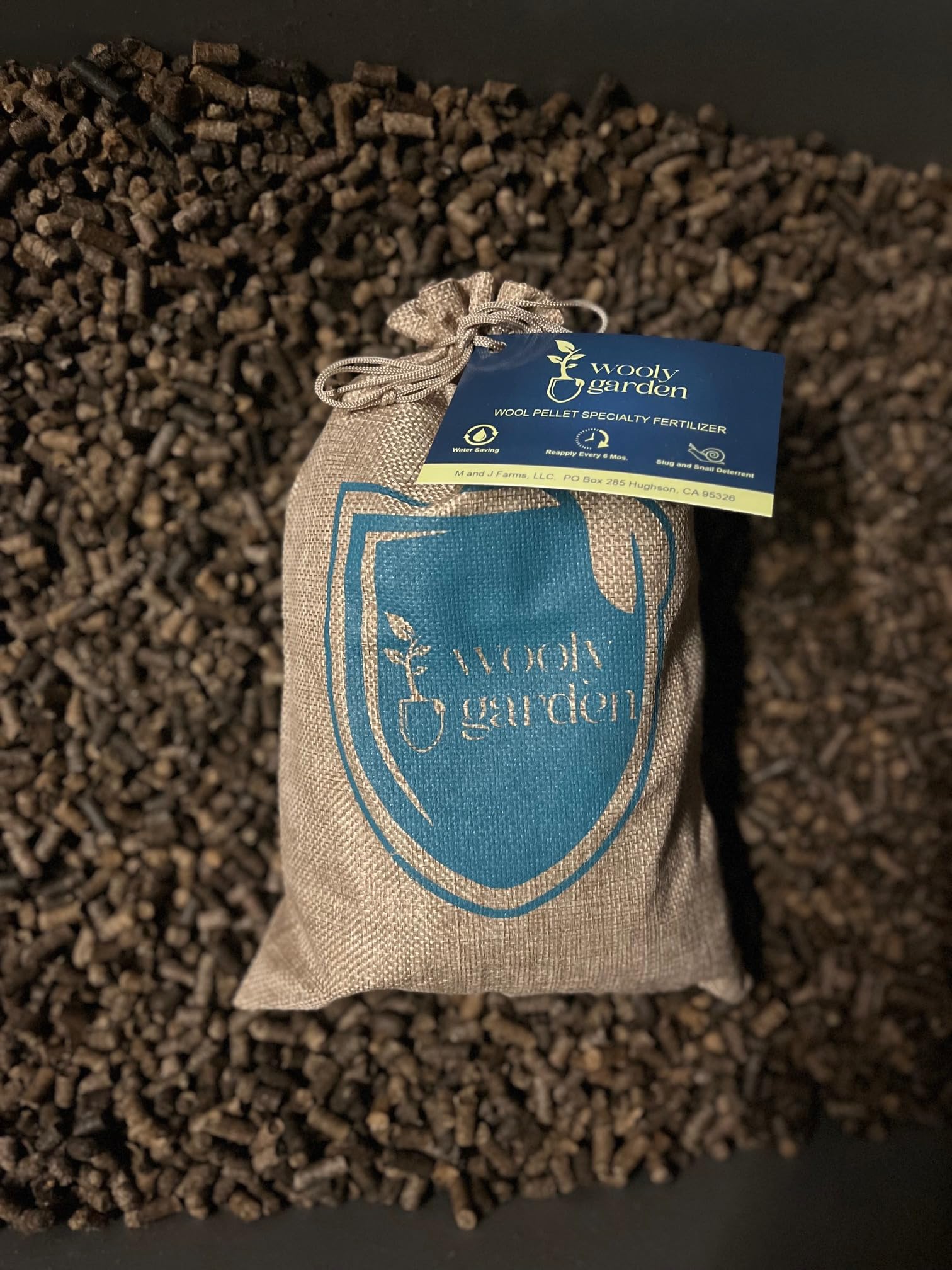 Wooly Garden 2lb bag beside a ruler showing compact size