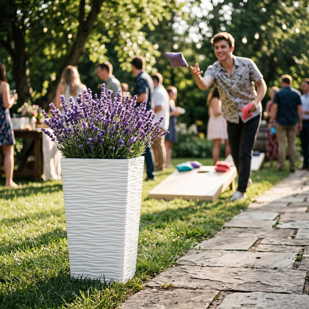 Worth planter on patio with mixed greenery illustrating weather-resistant use