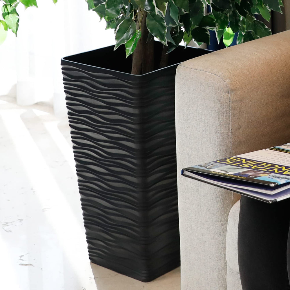 Worth pair of planters on porch framing doorway and improving curb appeal
