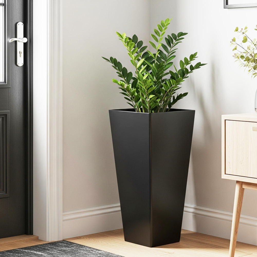 Worth planter beside chair showing size scale for placement planning