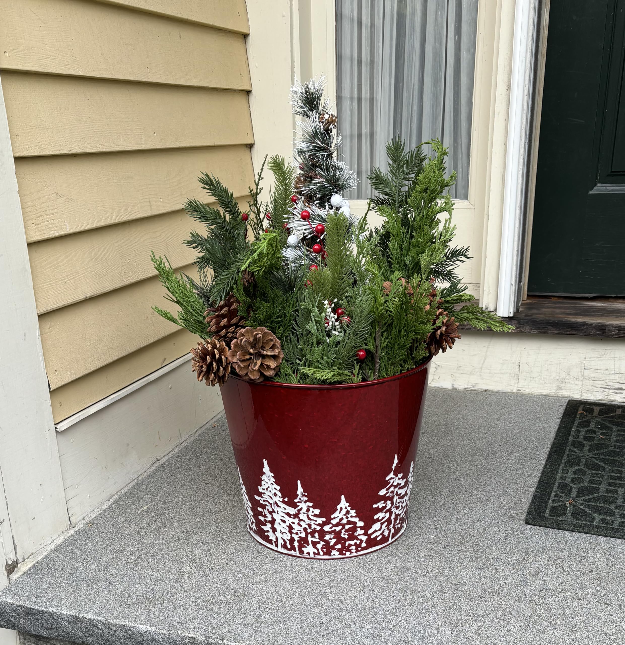 Worth Imports planter in use on patio with mixed plants showing durable outdoor benefit