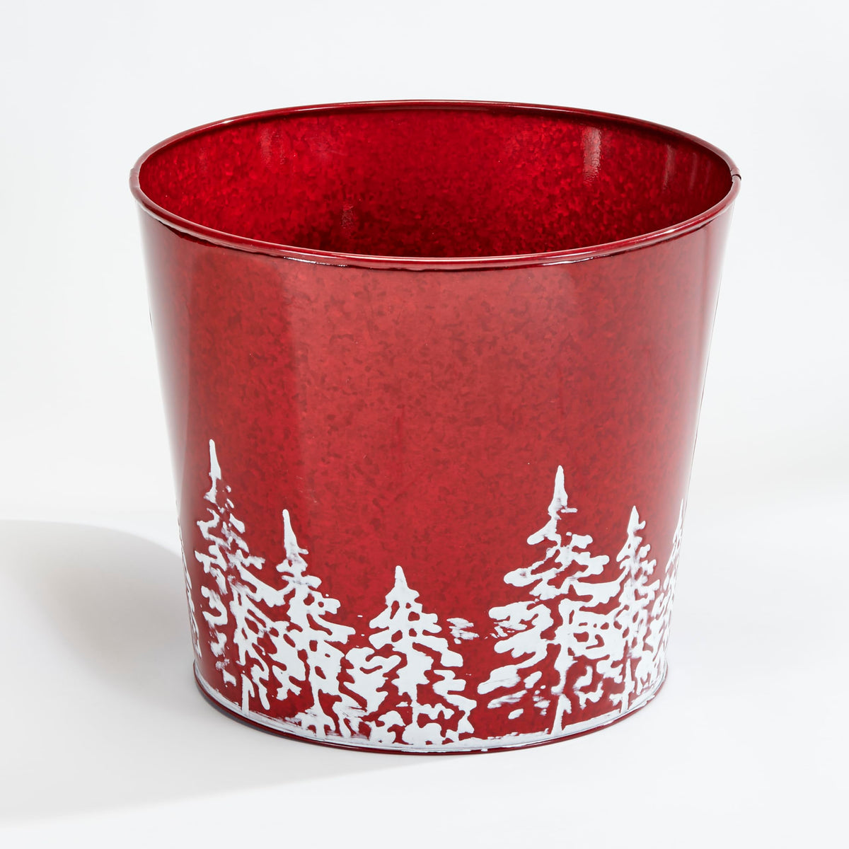 Worth Imports red galvanized planter front view showing festive tree and sturdy rim for display