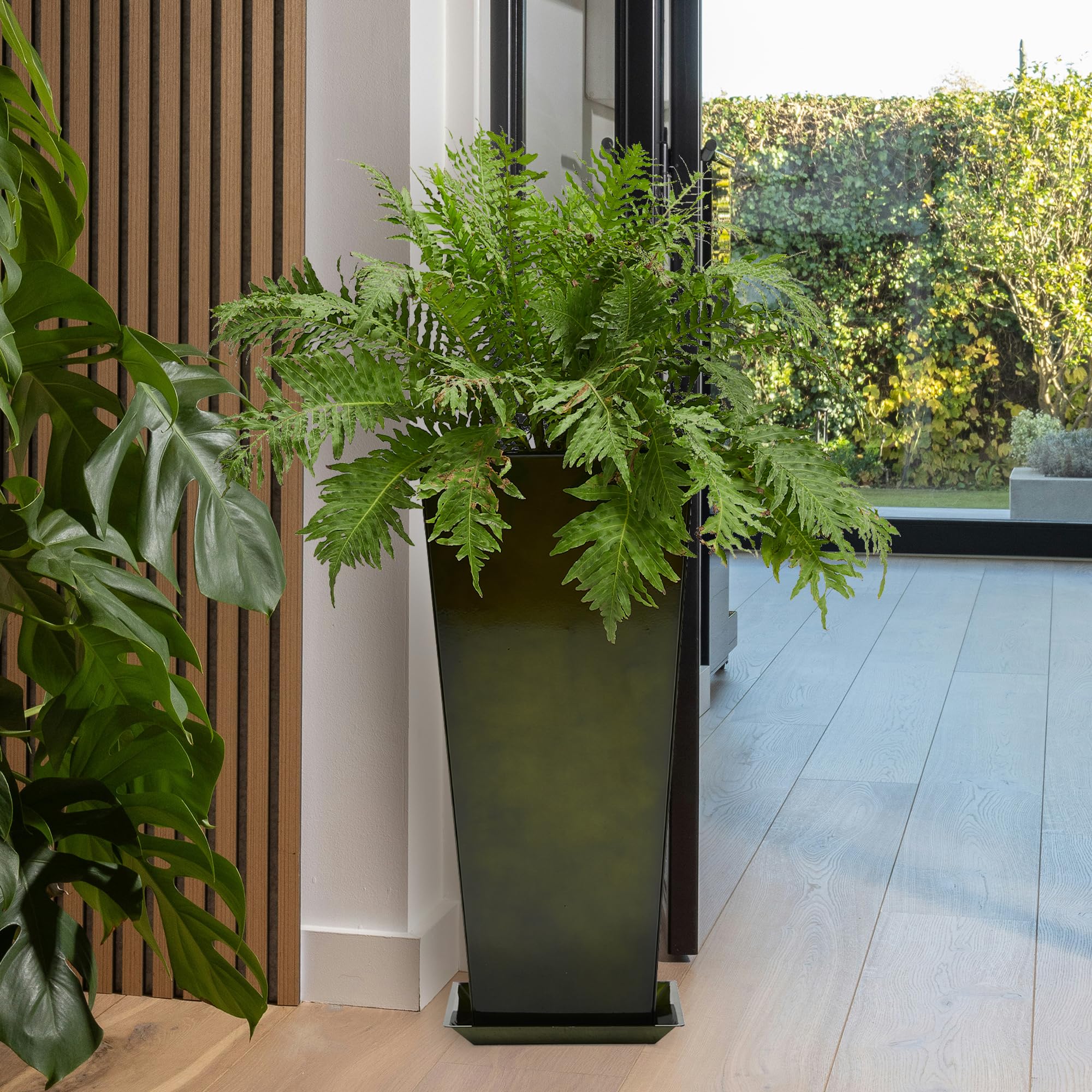 Worth planter staged with fiddle-leaf fig showing dramatic room accent