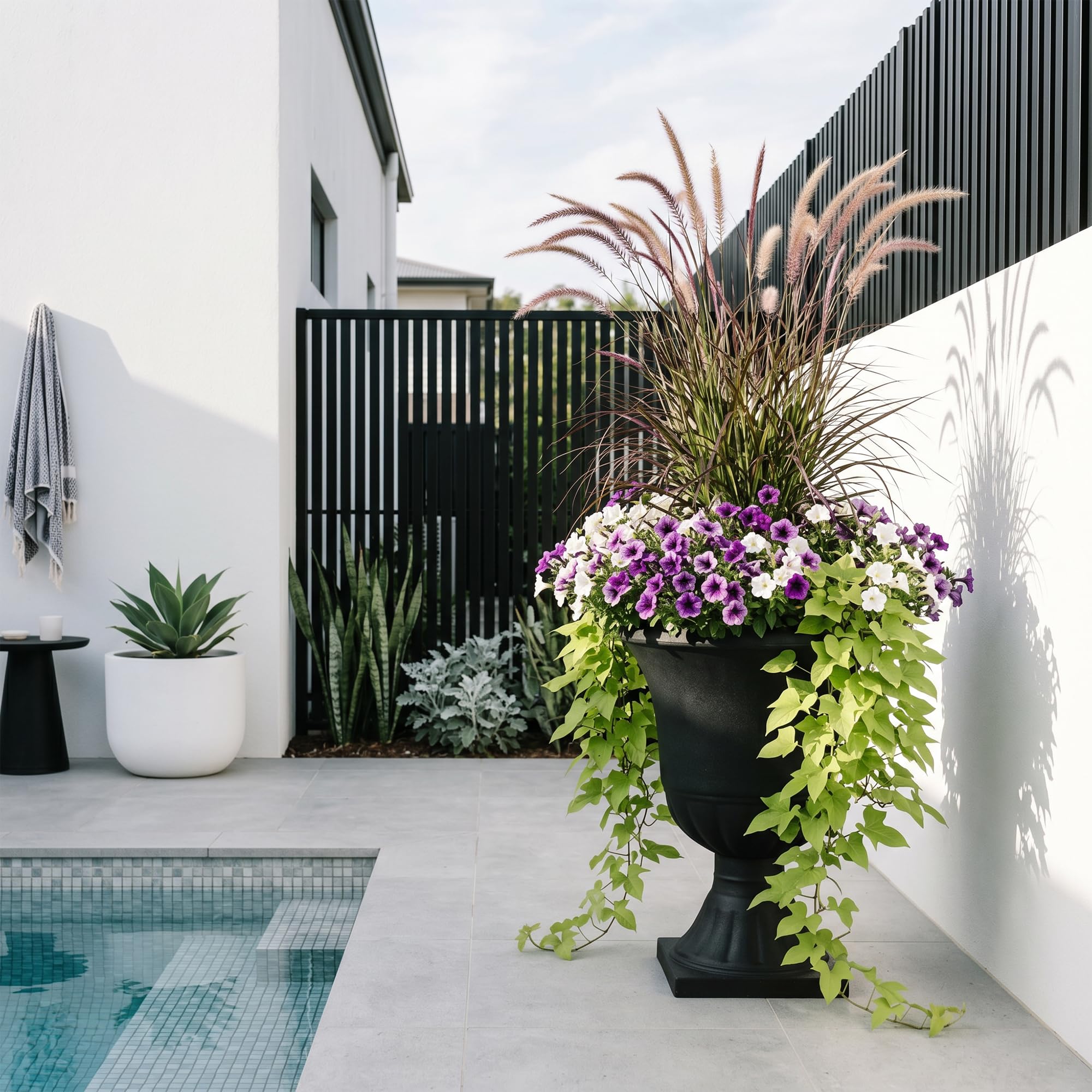 Worth pair of urns flanking steps providing symmetrical entrance impact